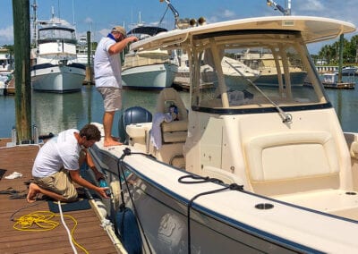 Our crew detailing a boat in Wild Dunes Yacht Harbor