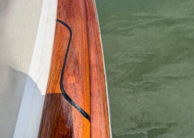 Caulk repair done on toe rail by Charleston Boat Detailing